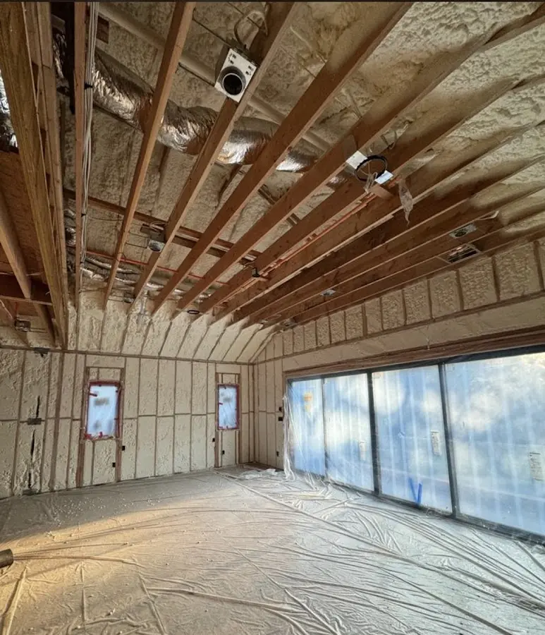 Interior walls and ceiling insulated with spray foam during new construction in Plainville
